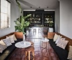 indoor bench seating with bar in the background