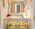 hotel bathroom with large mirror and sink