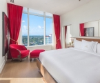 hotel bedroom with large windows 