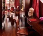 wooden desk and chair with dining table in the background