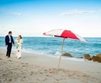 Couple walk along the beach