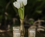 Side table with small floral arrangement and candles