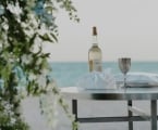 Table on the beach with items for the ceremony.