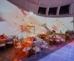 white flowers projected on interior walls at Faena Forum wedding venue